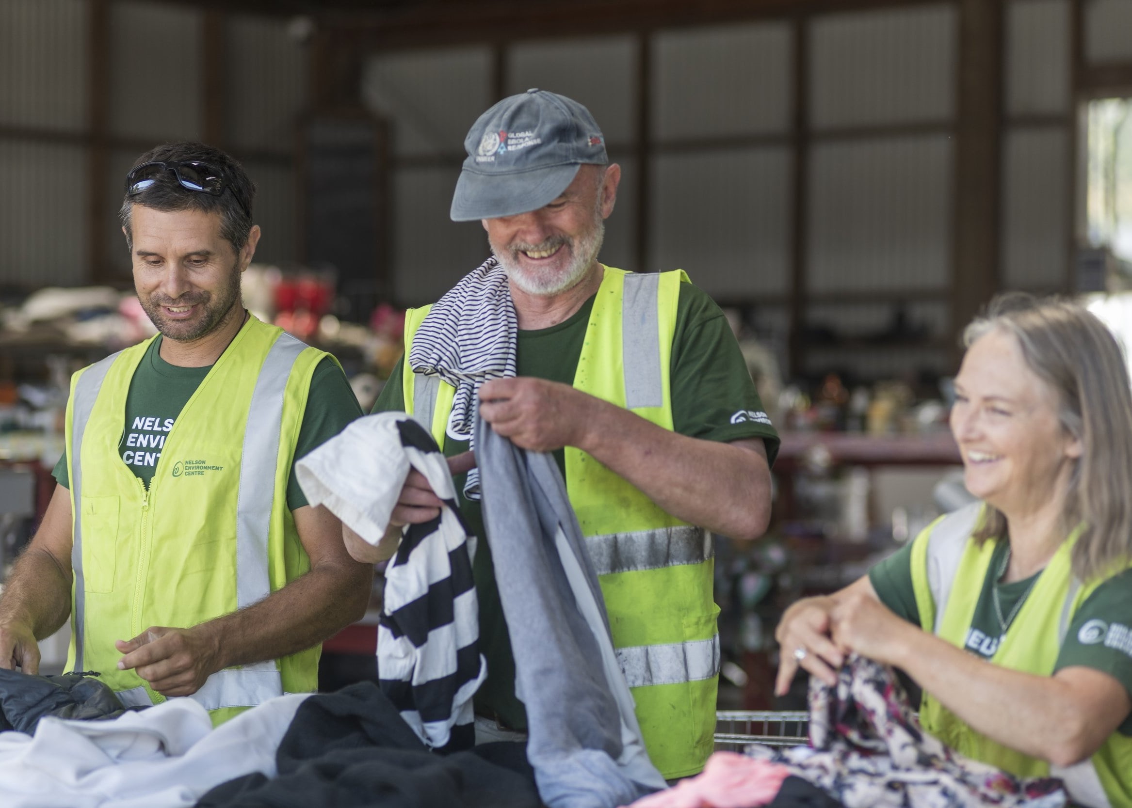 NEC staff sorting recycled clothes